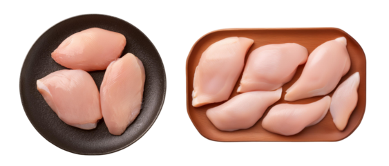 Fresh, raw chicken breasts on black and brown plates, white isolate background.