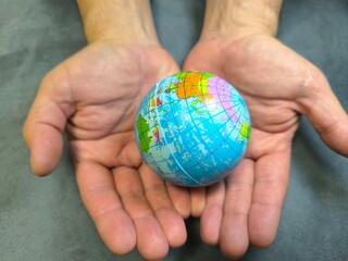 globe held by human hands. Ecology and the concept of globalization