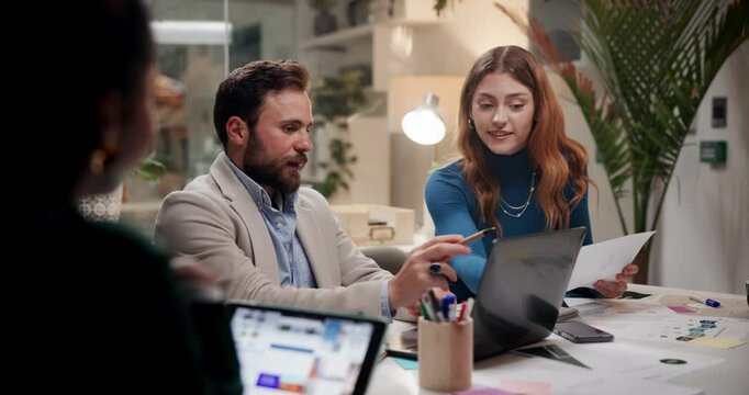 Business people, documents or meeting with laptop at night for project deadline or schedule planning at office. Group, employees or team working late with computer for collaboration, report or review