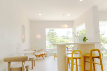 Blurry background interior design bar table chair window decorate indoors space display. Blurred background cafe coffee shop restaurant in shopping mall with light bokeh business event retail store