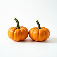Obraz premium Two Small Pumpkins on White Background 