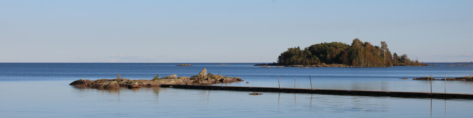 View from Vita Sannar, Sweden. Rock formation and small island, Lake Vanern.