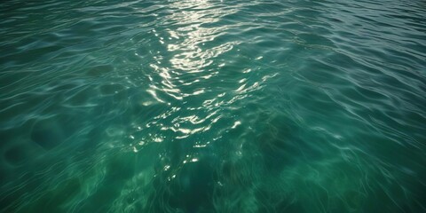 Naklejka premium Softly glowing emerald green water surface with gentle ripples, calming scene, natural ambiance, aquatic landscape