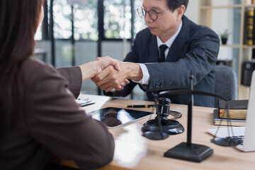 Lawyer man shaking hands with customer, Contract agreement, Lawyer or judge consult.