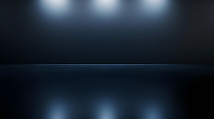 A dimly lit room with three overhead lights illuminating the space. The room is dark and the lights are positioned high on the ceiling, creating a sense of depth and spaciousness