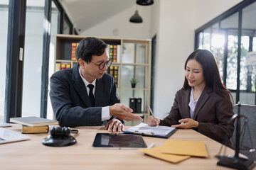 Lawyer or judge consult, Businessman and woman lawyers discussing about contract and agreement concept.
