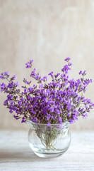 Small Clear Glass Vase with Dried Statice Flowers for Minimalist and Delicate Table Accents