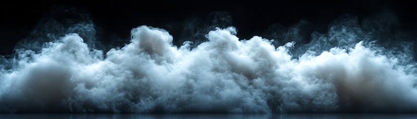 Obraz premium Dense white fog rolls across a dark expanse, creating an ethereal and calm environment