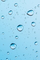 Close-up of water droplets on a blue background, creating a serene and refreshing atmosphere.