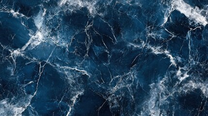 Naklejka premium A textured dark blue marble background with white veining, suitable for design and decor.