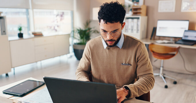 Doctor, man or typing on laptop in hospital for checking patient information, medical records or treatment research. Healthcare, admin and technology for test results or online prescription in clinic