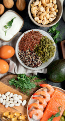 Assortment of omega 3 best sources on dark background.