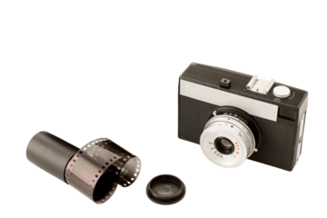 Isolated antique camera and filmstrip on white background, analog photography concept, copy space, PNG transparent 