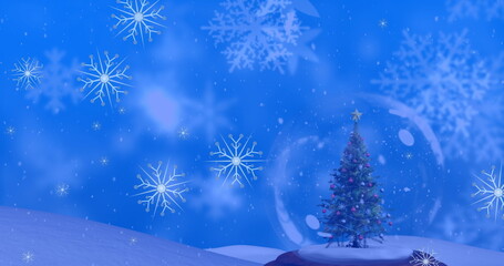 Image of snowflakes over snow globe with christmas tree