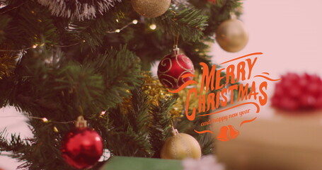 Image of christmas greetings text over christmas presents and decorations