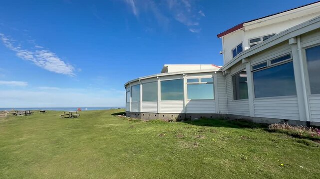 Glass windowed exterior of the Overleaf Lodge and Spa, in Yachats Oregon