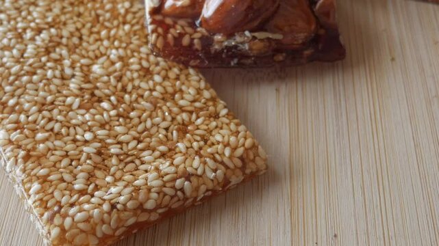 Pan view of nougat and sesame bar with honey