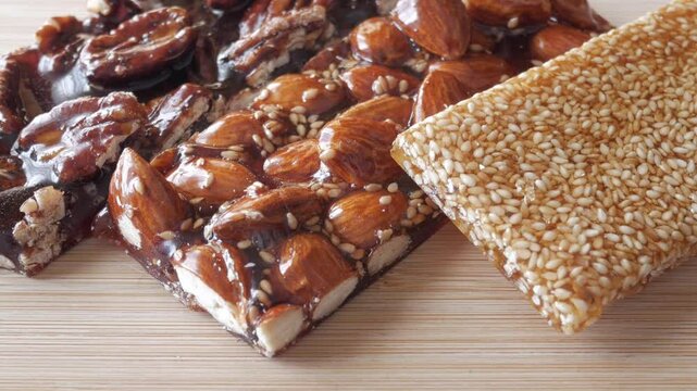 Zoom out of traditional spanish Guirlaches. Nougat and sesame bars with honey.