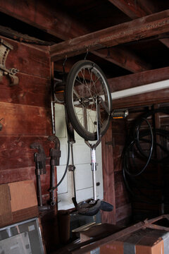 Unicycle Hanging Upside Down in Barn in Indiana