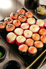 set of sushi rolls on a plate with ginger