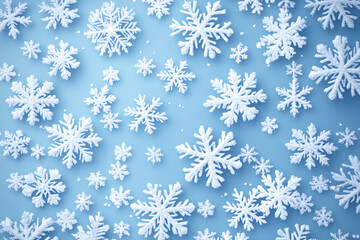 many snowflakes on a light blue background. winter or christmas background