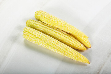 Raw sweet baby corn heap