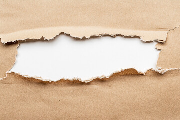 torn brown paper background with white copy space