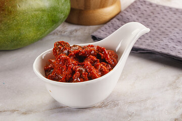 Spicy pickled raw green mango