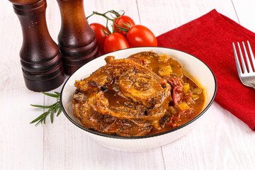 Italian cuisine - ossobuco with sauce