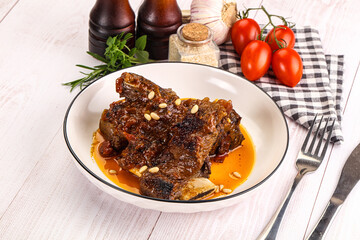 Prepared tasty beef ribs with sauce