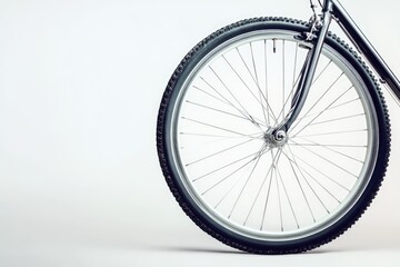 Fototapeta premium Sporty Bicycle Wheel Isolated on White Background with Spokes and Tire, Perfect for Cycling Themes
