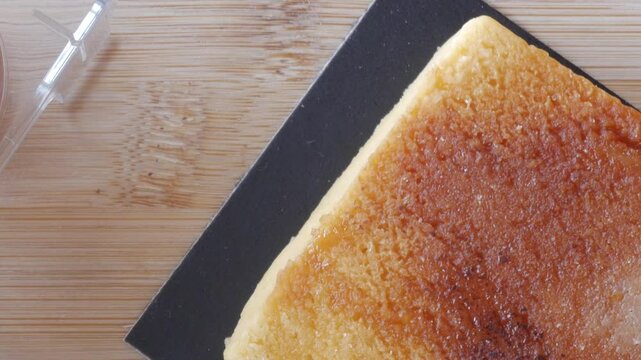 Sweet Turron Yema block on wooden board, top view, dessert concept