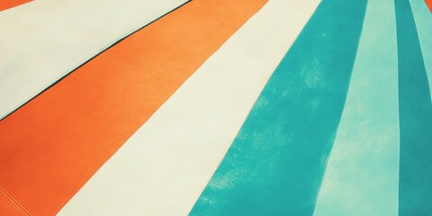 Flaky beach umbrella fabric texture showcasing vibrant color patterns under sunlight at a coastal location