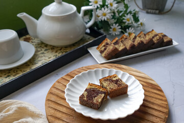 Slices of marble cake on white plates