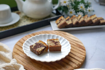 Slices of marble cake on white plates