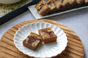 Slices of marble cake on white plates