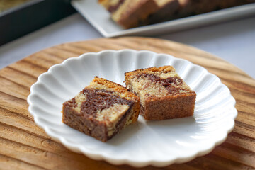 Slices of marble cake on white plates