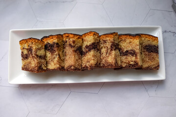 Slices of marble cake on white plates