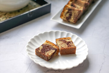 Slices of marble cake on white plates