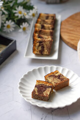 Slices of marble cake on white plates