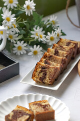 Slices of marble cake on white plates