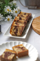 Slices of marble cake on white plates