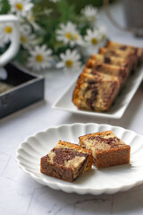 Slices of marble cake on white plates