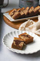 Slices of marble cake on white plates
