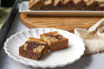 Slices of marble cake on white plates