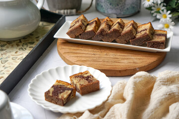 Slices of marble cake on white plates