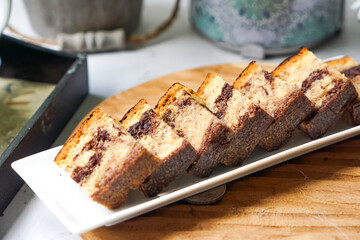Slices of marble cake on white plates