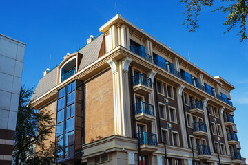 A contemporary architectural structure showcasing unique design elements and vibrant balconies.
