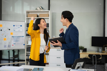 Fototapeta premium Asian business people working as a good team in the office. Successful teamwork in a meeting, workplace concept.