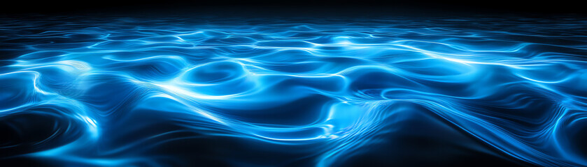 Naklejka premium A serene blue water surface reflecting light patterns in a tranquil environment.